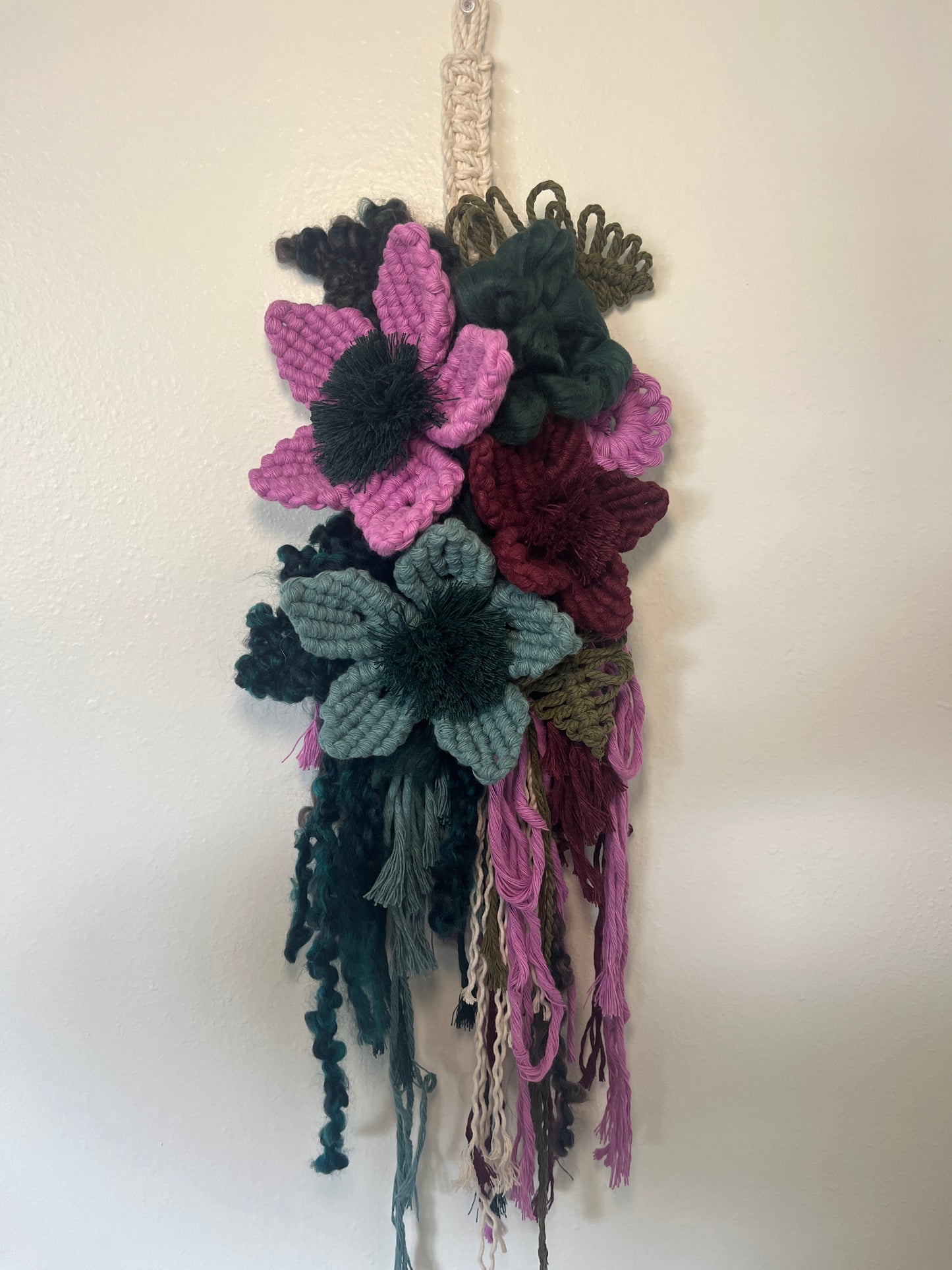 Lilac, Evergreen, + plum floral wall hanging
