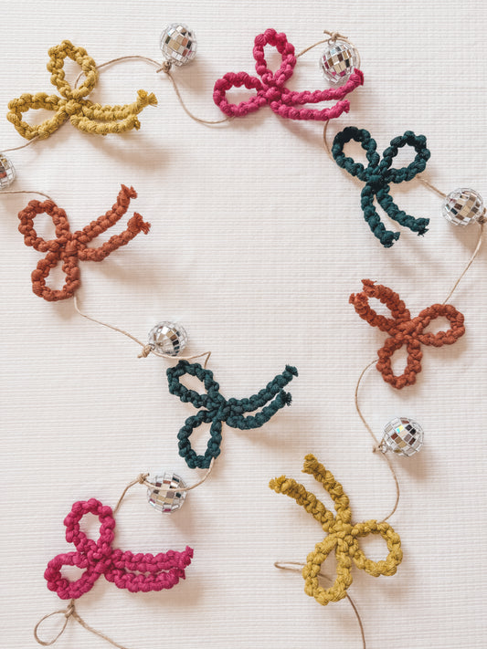 Holiday bow + Christmas tree garlands