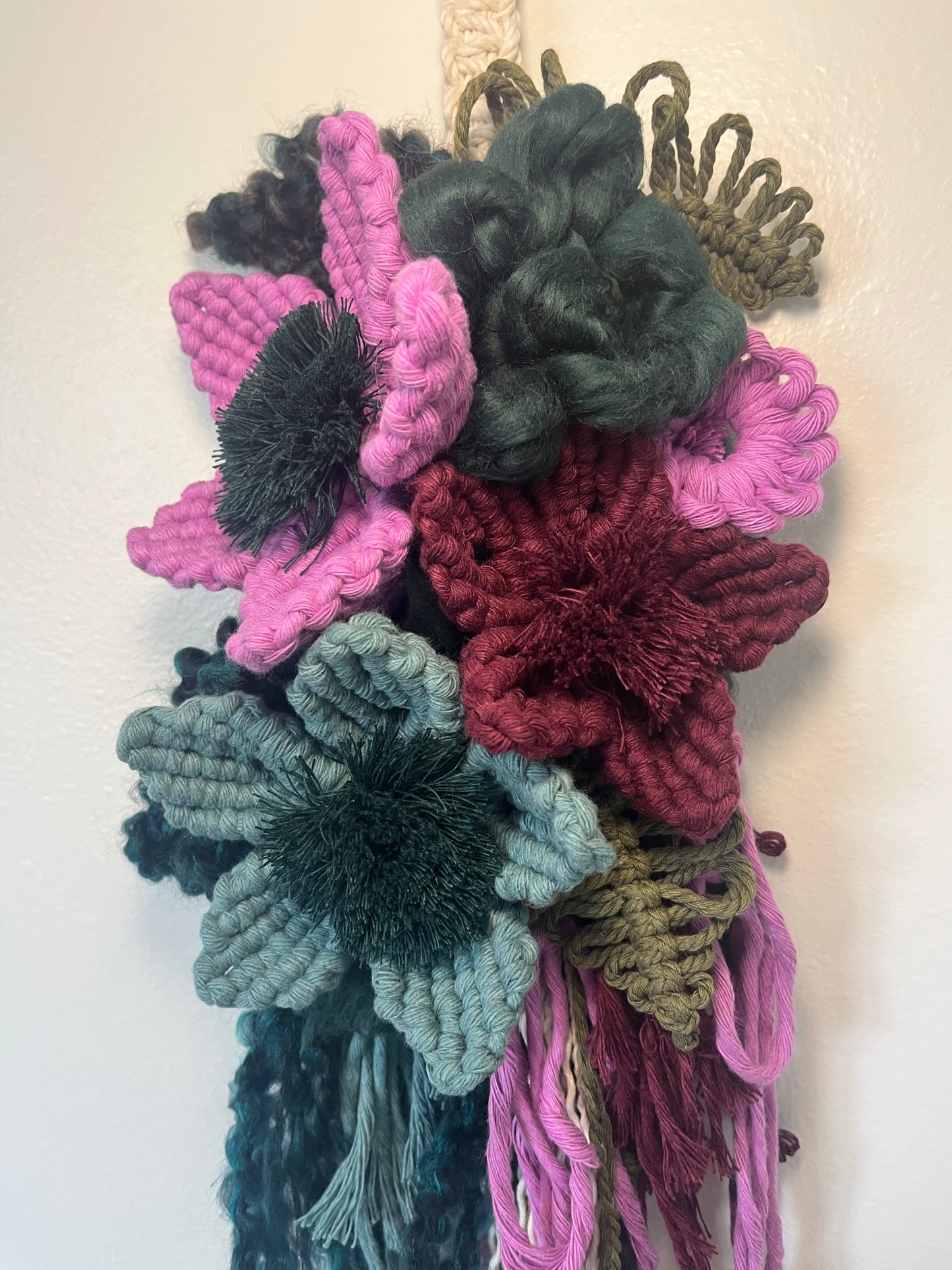 Lilac, Evergreen, + plum floral wall hanging